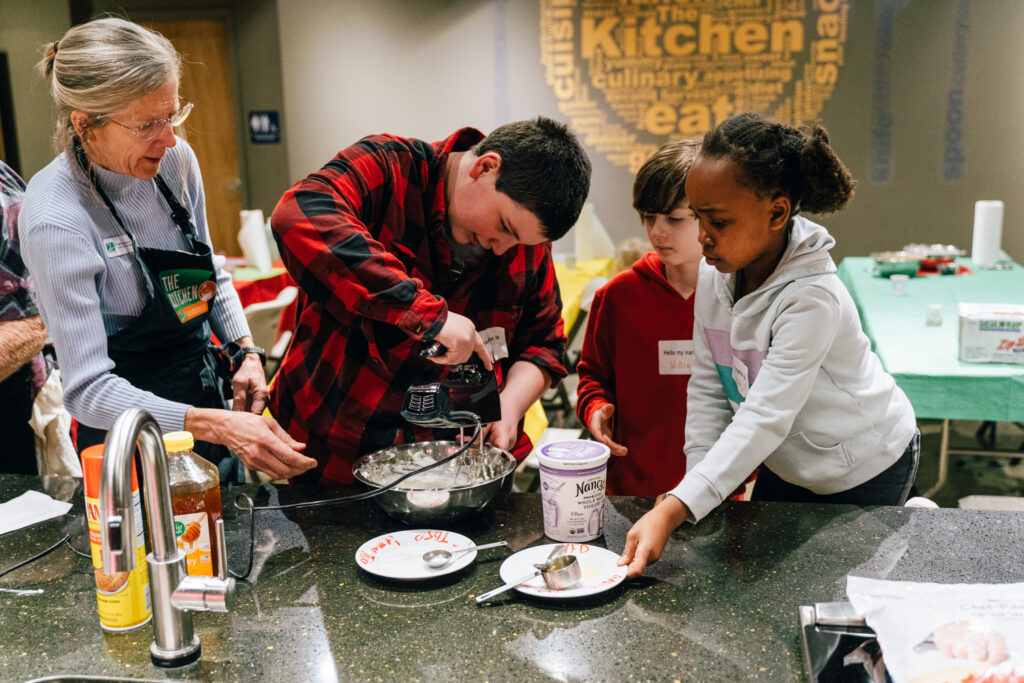 Kids Camp attendees using a mixer