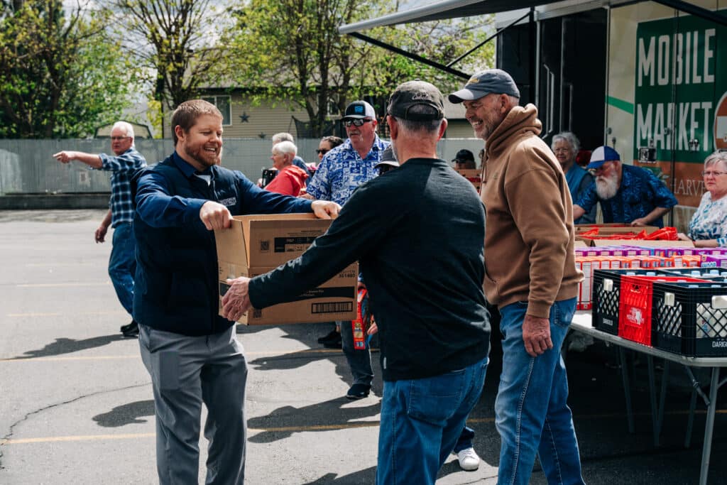 Rathdrum Mobile Market volunteers distribute food