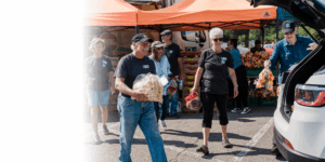 Volunteers distribute food at a Mobile Market
