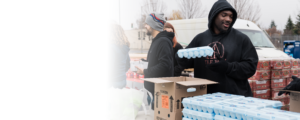 Volunteer distributing food at a Mobile Market