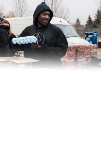 Volunteer distributing food at a Mobile Market