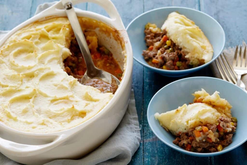 Cottage Pie being served into dishes