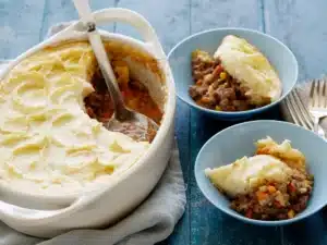 Cottage Pie being served into dishes