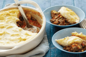 Cottage Pie being served into dishes