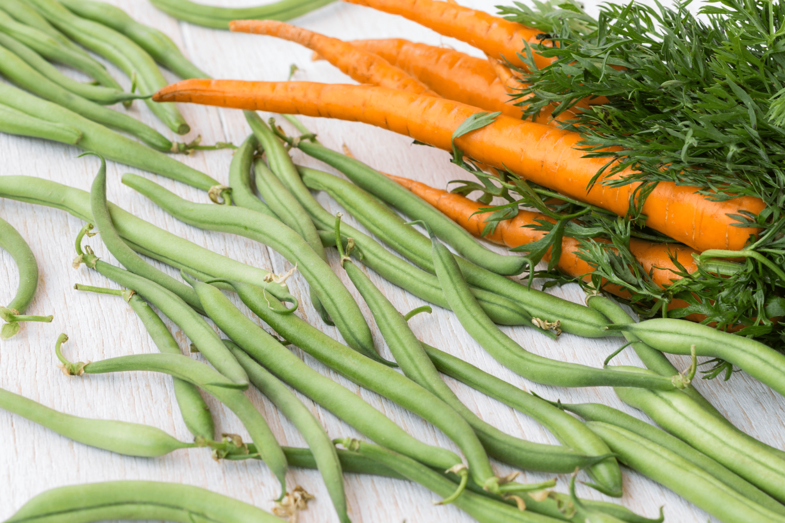 Green beans and carrots on a table